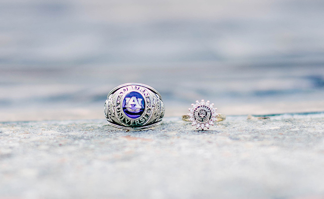 The traditional ring and women's dinner ring sit on top of the Auburn seal- that sits in front of Langdon Hall on campus.