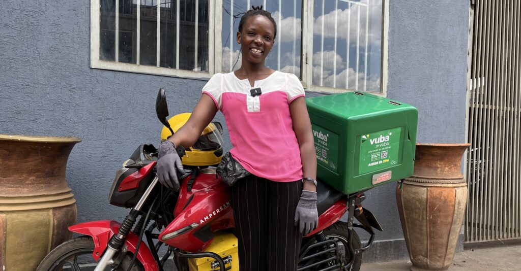 Female delivery driver using an electric motorcycle