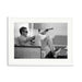 Steve McQueen Aims a Pistol Framed Print - White