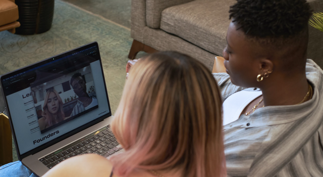 Two people looking at call on computer screen.png