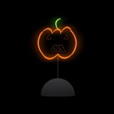 Neon face pumpkin on stand