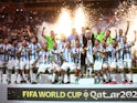 Argentina's Lionel Messi celebrates with the trophy and teammates after winning the World Cup on December 18, 2022