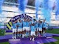 Manchester City's Ilkay Gundogan lifts the trophy as he celebrates with teammates after winning the Premier League on May 21, 2023