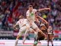 FC Augsburg's Jeffrey Gouweleeuw competes for the ball during his side's Bundesliga game against St Pauli on September 15, 2024