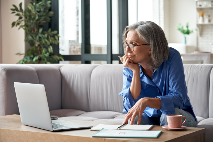 Senior woman looking at laptop