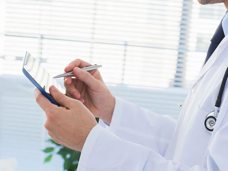 Doctor holding clipboard