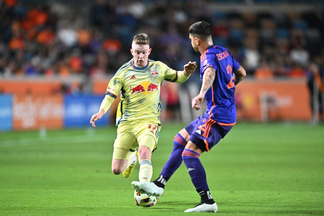 Mar 2, 2024; Houston, Texas, USA; New York Red Bulls midfielder Cameron Harper (17) dribbles the ball in the second half against Houston Dynamo FC at Shell Energy Stadium. Mandatory Credit: Maria Lysaker-USA TODAY Sports