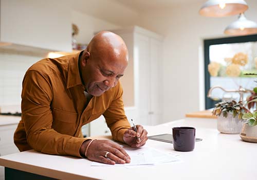 Retired Man Reviewing Documents