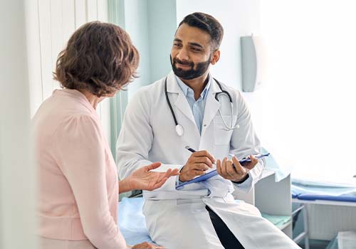 Doctor Giving Care To Medicare Patient