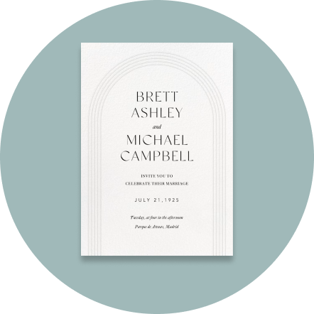 A white invitation with a simple arch on a light blue backdrop.