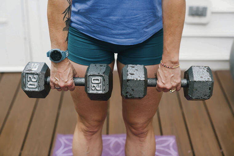 NEW YORK TIMES
                                Alison Gittelman, an experienced marathoner and triathlete, uses weights while exercising at her home in Chantilly, Va. Gittelman incorporated more strength training into her exercise routine once she entered menopause.