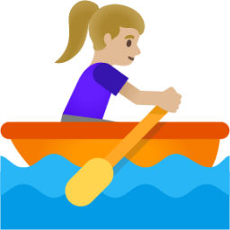 woman rowing boat: medium-light skin tone emoji