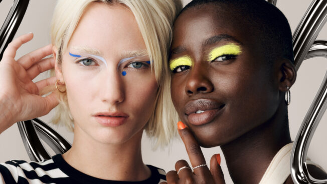 two models with very colorful eye shadow