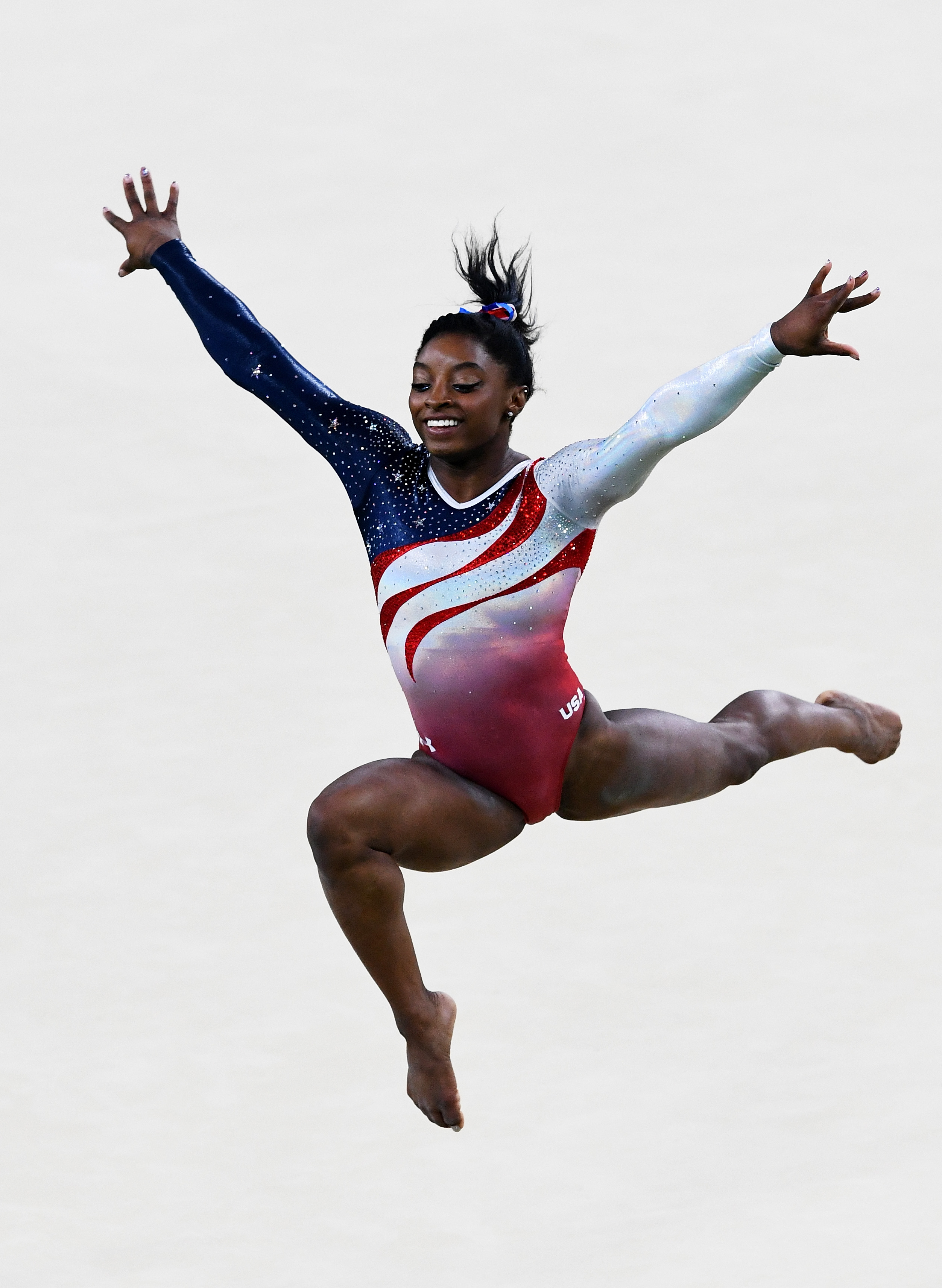 Simone Biles of the United States competes on the floor during the Artistic Gymnastics Women’s Team Final on Day 4 of the Rio 2016 Olympic Games at the Rio Olympic Arena on August 9, 2016 in Rio de Janeiro, Brazil