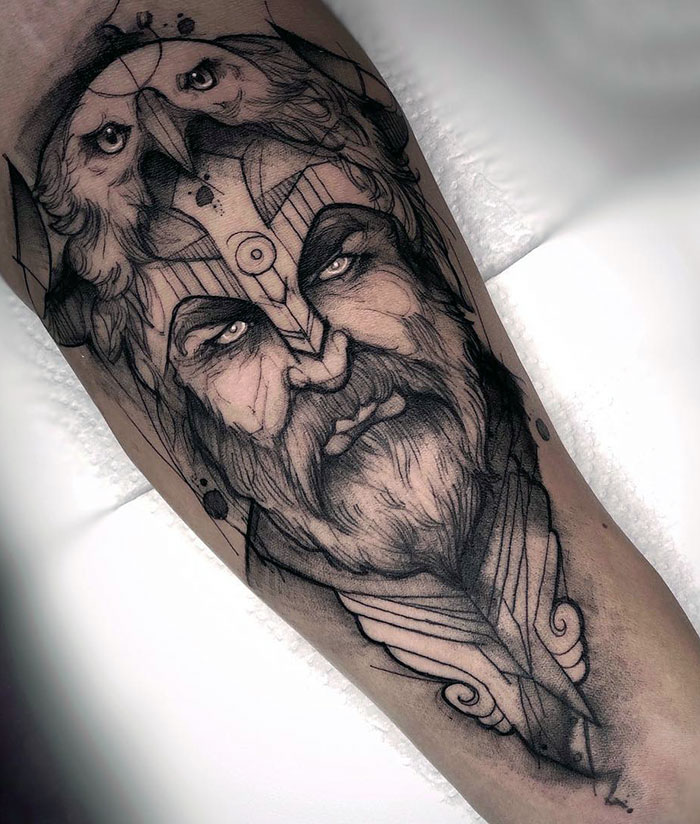 Detailed Viking tattoo featuring a bearded warrior with an intricate helmet design.