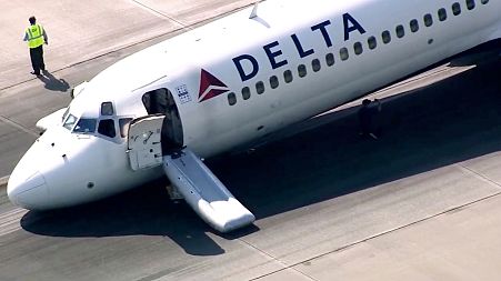 A Delta plane lands without its landing gear at the Charlotte Douglas International Airport, Wednesday, June 28, 2023 in Charlotte, N.C. 