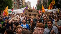 Demonstrators march shouting slogans against the Formula 1 Barcelona Fan Festival in downtown Barcelona, 19 June 2024.