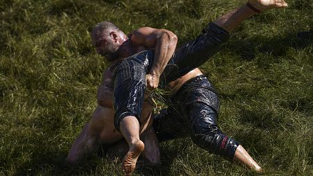 Wrestlers compete during the 663rd annual Historic Kirkpinar Oil Wrestling championship, in Edirne, northwestern Turkey