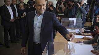 Bulgaria's President Rumen Radev casts his vote at a polling station in Sofia, Sunday, April 2, 2023.