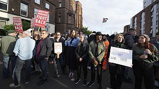 Counter protestors gather in Liverpool, Wednesday, Aug. 7, 2024 ahead of anti-immigration groups planning to target dozens of locations throughout the country following a week