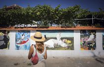 Katarzhina Piryankov walks along "MOMA" street in the village of Staro Zhelezare, Bulgaria.