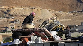 Lebanese civilians fleeing from Israeli air strikes.