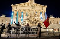 Anti right wing protesters shout slogans and hold an banner that reads "Don't let Nazis rule and never let them march" in Vienna, Austria, Sunday, Sept. 29, 2024,