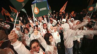 Supporters of the opposition alliance "Coalition for changes" attend rally ahead upcoming parliamentary election in western city of Zugdidi, Georgia, late Wednesday, Oct. 23, 