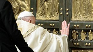 Pope Francis opens the Holy Door to mark the opening of the 2025 Catholic Holy Year, or Jubilee, in St. Peter's Basilica, at the Vatican, Dec. 24, 2024. 