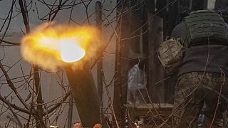 A Ukrainian serviceman of the 57th Mechanised Brigade fire 120mm mortar towards Russian positions near Kharkiv, Ukraine, Tuesday, Dec. 24, 2024