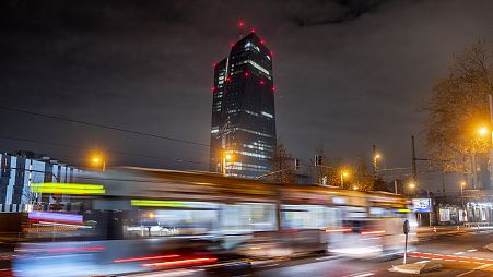 A tram passes the European Central Bank in Frankfurt, Germany