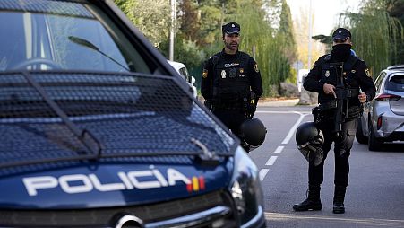 FILE- Police officers stand guard in Madrid, 30 November 2022