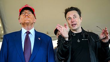 President-elect Donald Trump listens to Elon Musk as he arrives to watch SpaceX's mega rocket Starship lift off for a test flight from Starbase in Boca Chica, Texas, Nov. 19, 