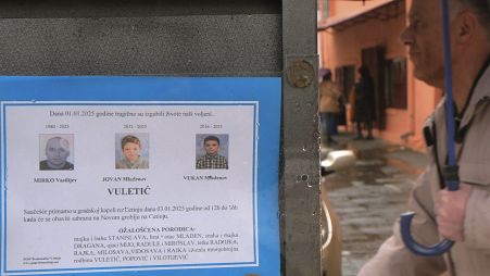 A man walks past death notices of victims of a shooting in Cetinje, 3 January, 2025