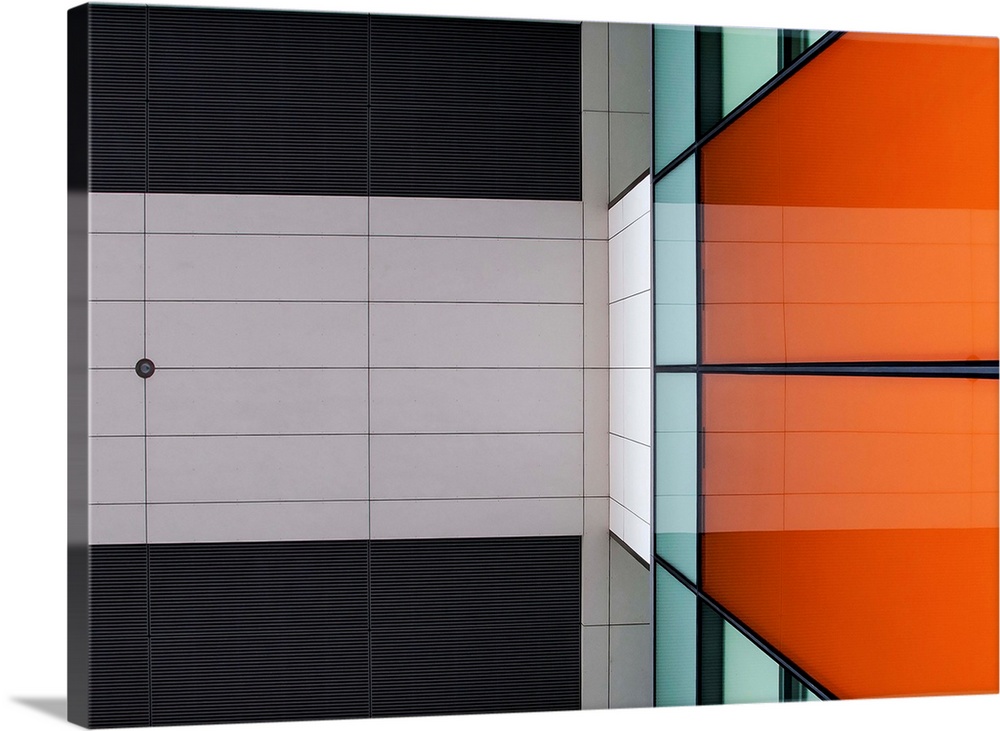 Orange glass and ceiling panels create an abstract image in Amsterdam.