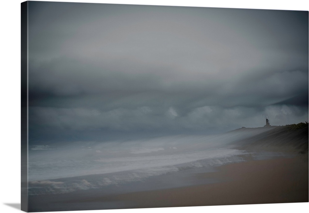 Landscape photograph of the beach on an overcast day, created with multiple exposures.