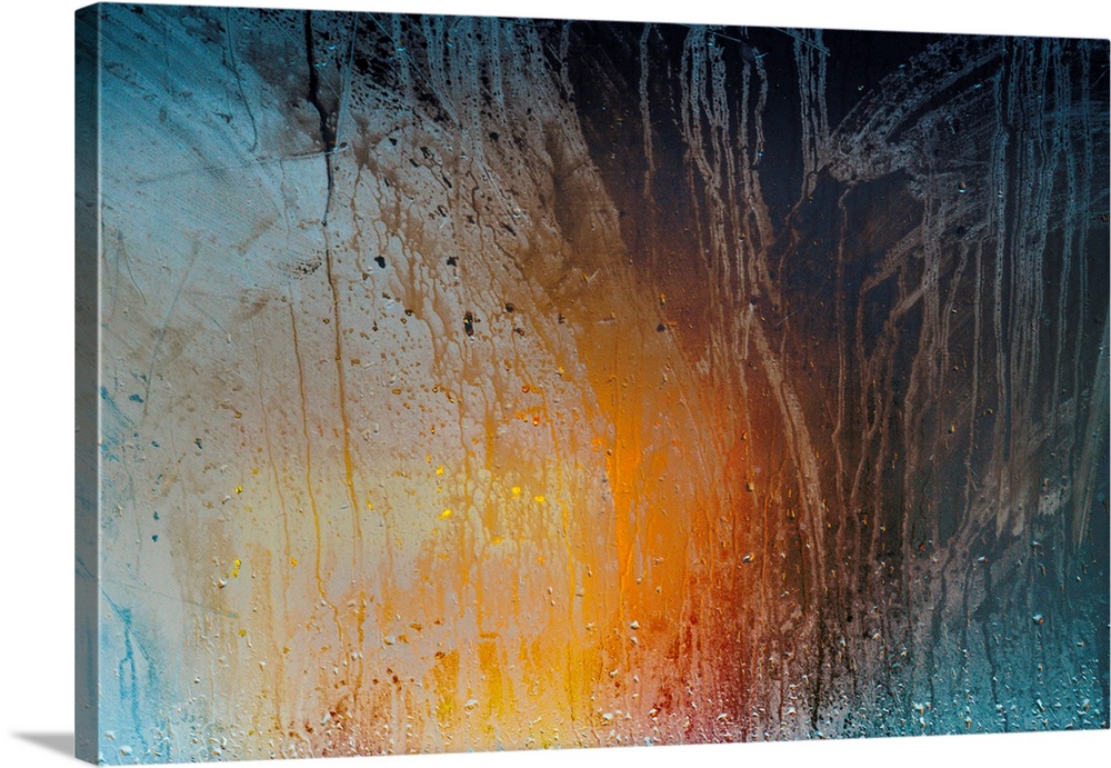 Fine art photograph of colorful lights shining on a foggy and wet window with beads of water running to the bottom.