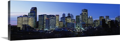 Buildings in a city lit up at dusk, Calgary, Alberta, Canada