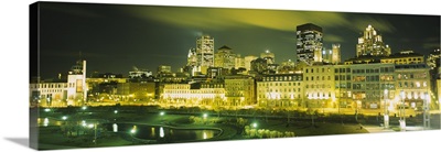 Buildings in a city lit up at night, Auberge Du Vieux Port, Montreal, Quebec, Canada