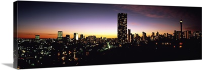 Buildings in a city lit up at night, Johannesburg, South Africa