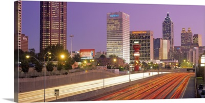 Traffic on the road in front of buildings at dusk, Atlanta, Georgia