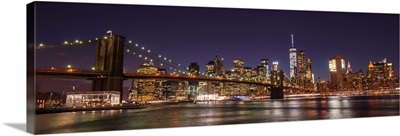 New York City Skyline with Brooklyn Bridge in Foreground, at Night