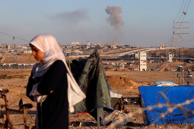 <p>Smoke rises following an Israeli airstrike on buildings near the separating wall between Egypt and Rafah, southern Gaza</p>