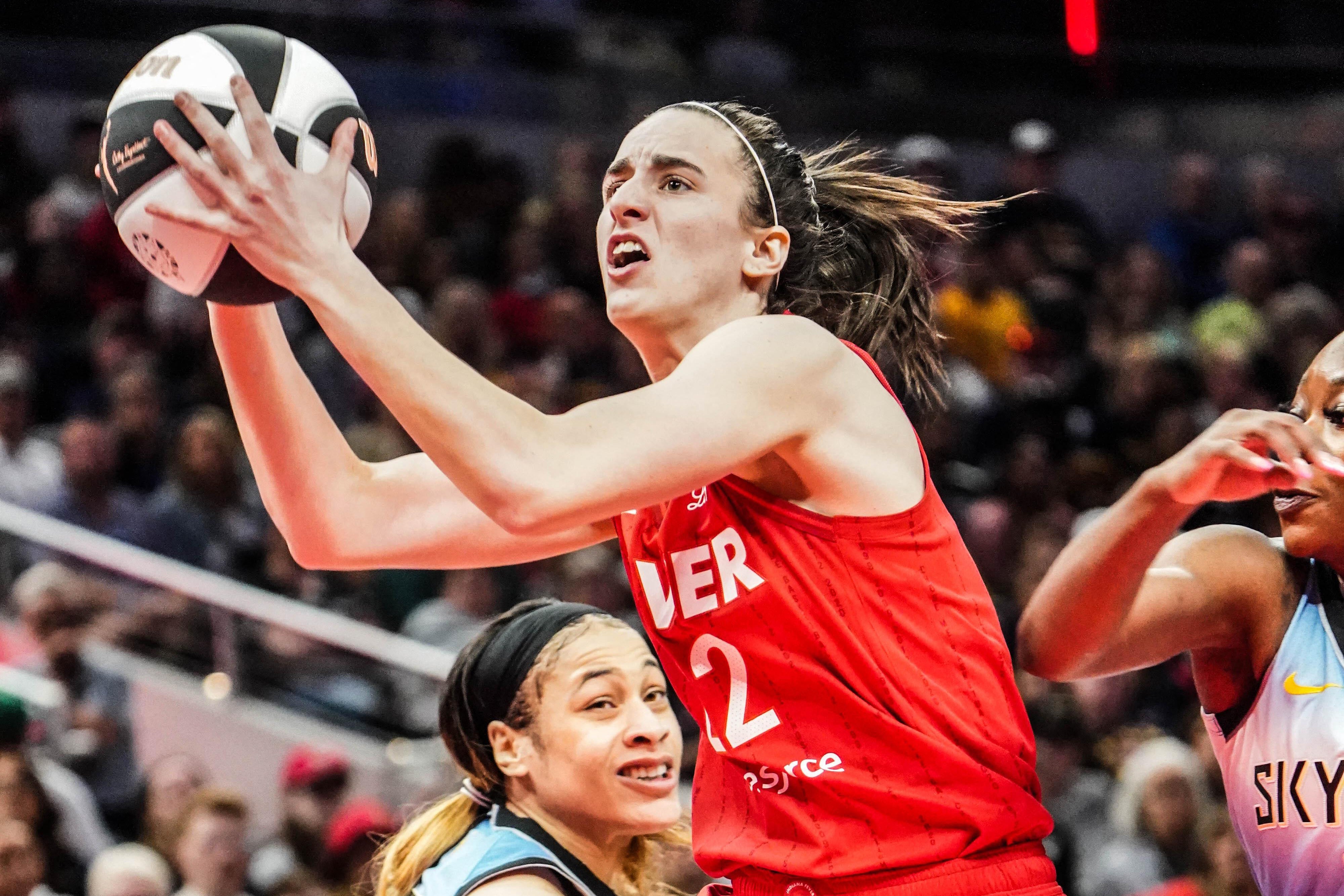 Indiana Fever guard Caitlin Clark drives to the basket against Chicago Sky during a game at Grainbridge Fieldhouse on Saturday