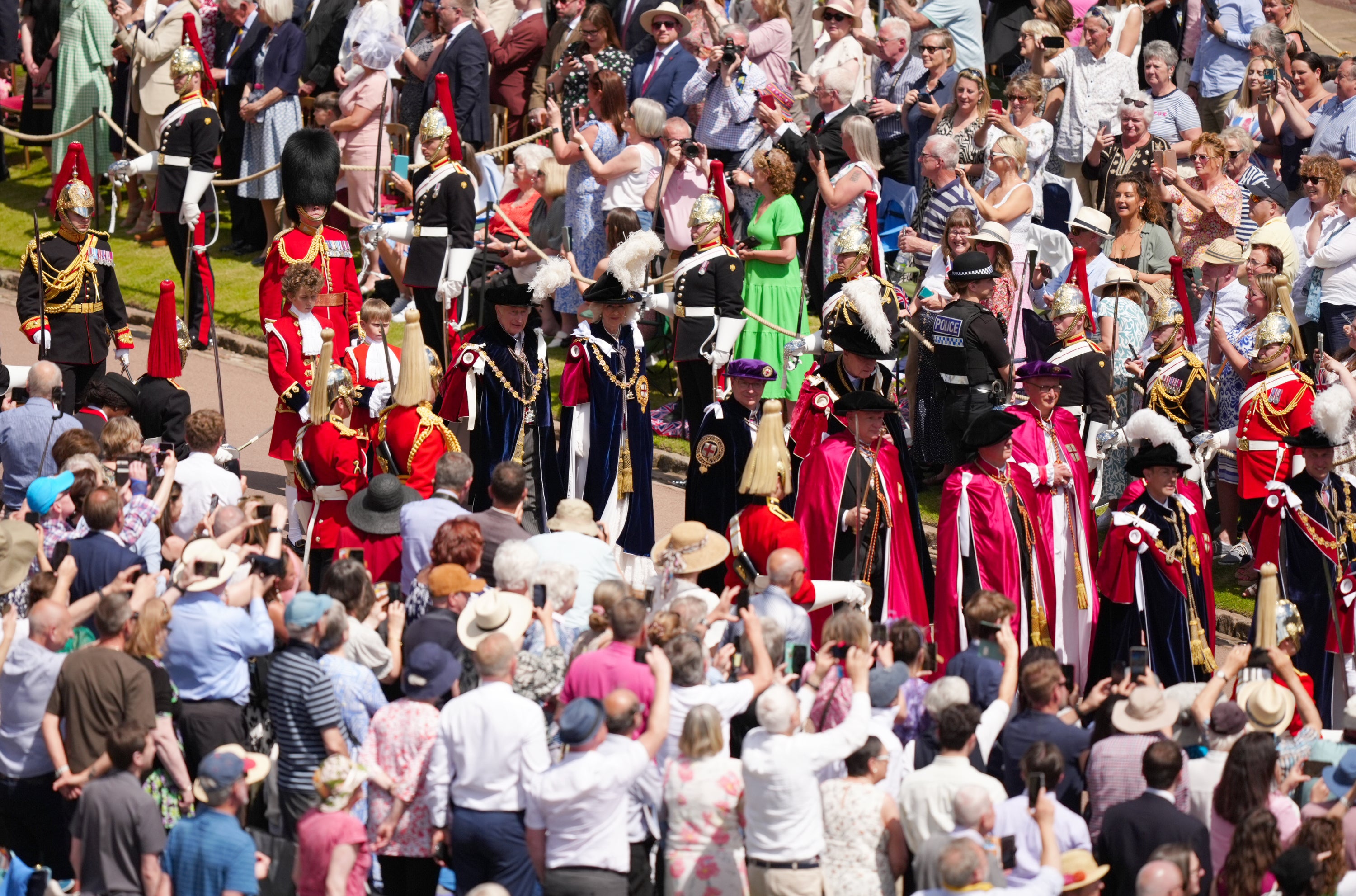 The King and Queen in their robes arrive to attend the annual Order of the Garter Service at St George’s Chapel (Aaron Chown/PA)