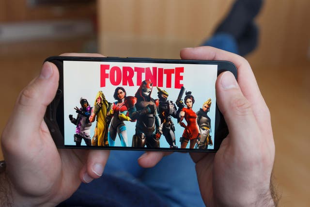 <p>Fortnite maker Epic Games is disputing a demand from Apple over its app (Alamy/PA)</p>