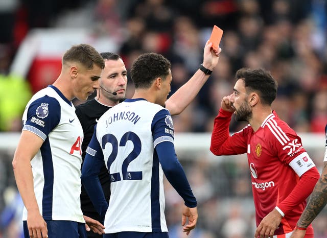 <p>Bruno Fernandes of Manchester United receives a red card from referee Chris Kavanagh</p>