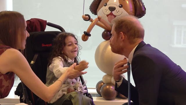 <p>Prince Harry bursts out laughing as young boy grabs his beard at WellChild charity event.</p>