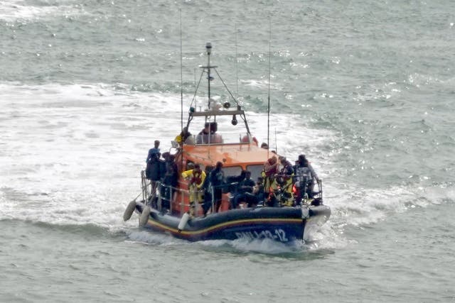 A group of people thought to be migrants are brought in to Dover, Kent (Gareth Fuller/PA)