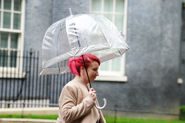 <p>Taking cover: Transport secretary Louise Haigh leaving Downing Street</p>